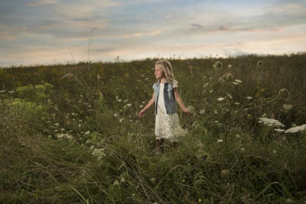 A little girl in a field of flowers