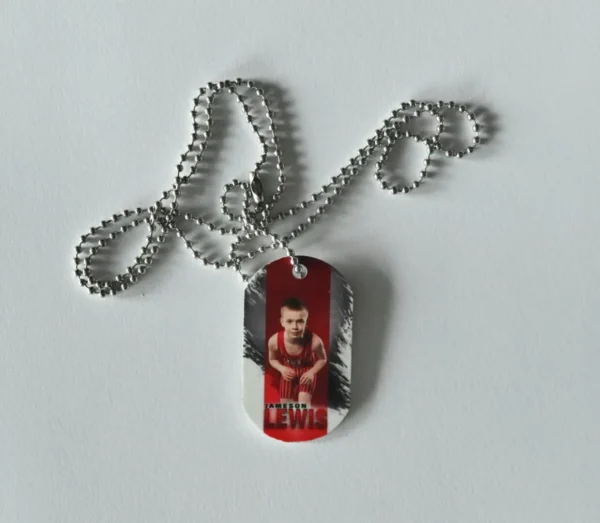 Silver chain with a photo ID tag.