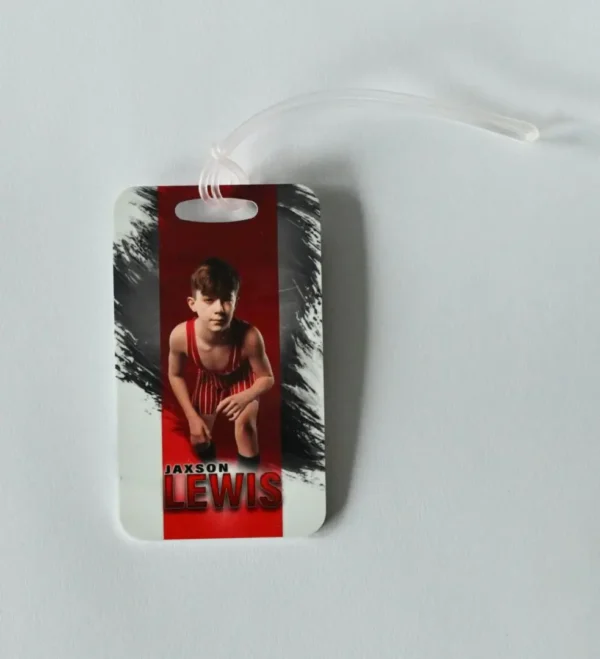 Jaxson Lewis luggage tag with boy's photo.