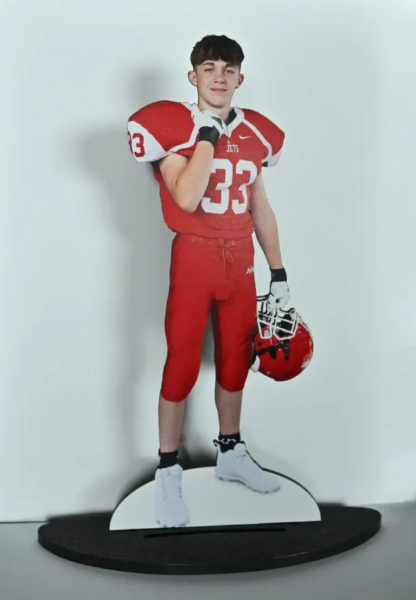 Football player wearing red jersey number 33.